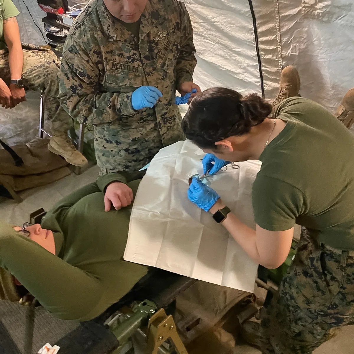 Dr. Brahe performing field surgery during deployment with 3rd Battalion, 6th Marines